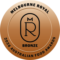 A circular bronze award badge reading 'MELBOURNE ROYAL 2026 AUSTRALIAN FOOD AWARDS' with a central stylized 'MR' monogram and the word 'BRONZE'.
